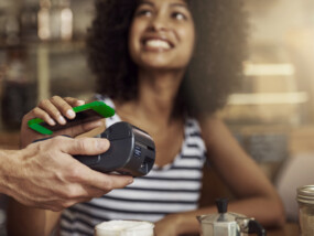 woman using smart phone to pay bill|woman using smart phone to pay bill