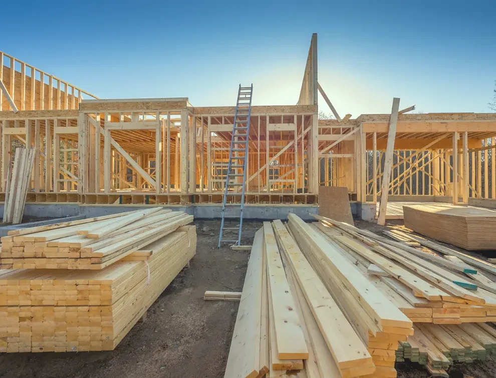 House frame being built with lots of wood