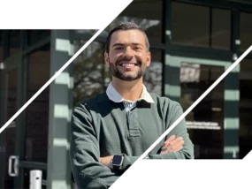 A picture of Darian Miles, an aficionado in financial literacy, crossing his arms and smiling at the camera.