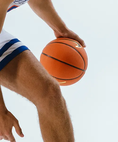 Basketball being dribbled by Boise State athlete – close-up action shot