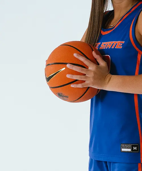 Women’s basketball athlete holding a basketball – Boise State Athletics close-up