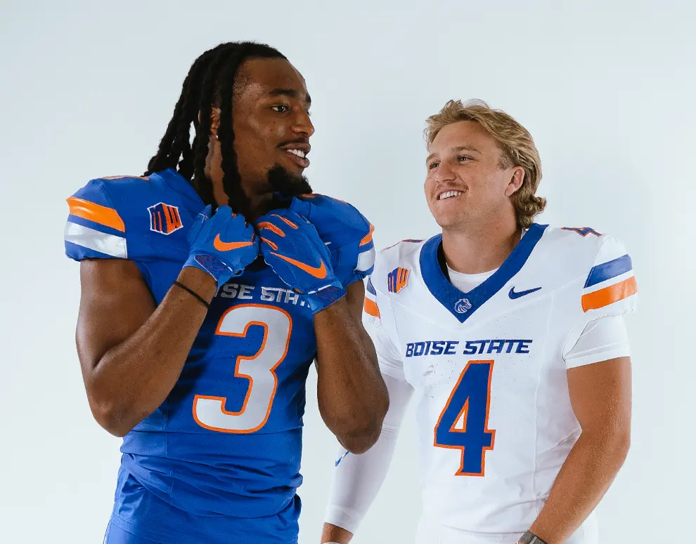 A candid shot of Boise State Football student-athletes Latrell Caples and Maddux Madsen.