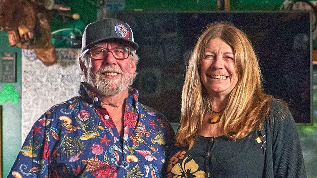 Capone's Pub & Grill business owners smiling.