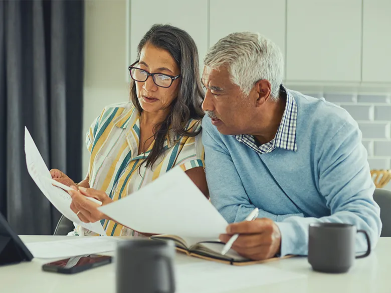 A couple looking at documents together.