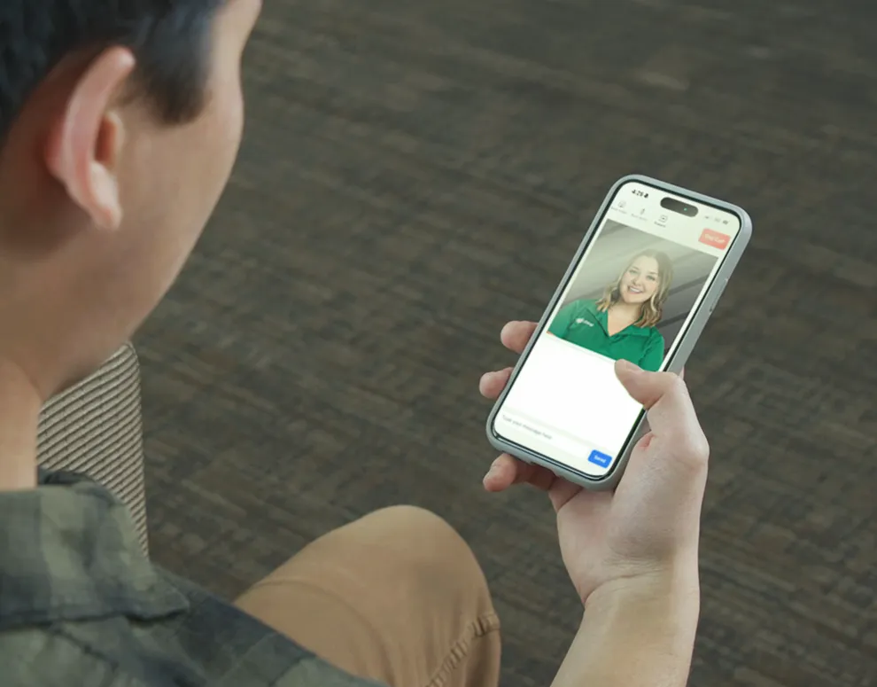 An ICCU member using VideoChat to speak with a team member.