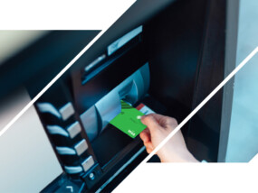 Someone putting an ICCU debit card into an ATM.
