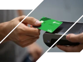 A man makes a purchase with an ICCU debit card