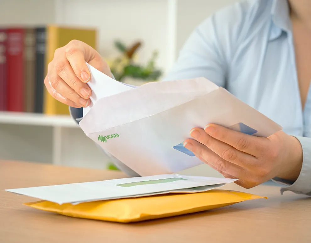 An image of a letter from ICCU being opened.
