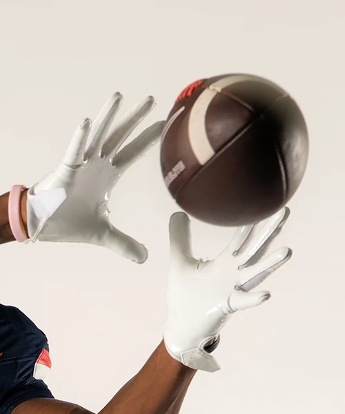 University of Arizona football player preparing to catch a football